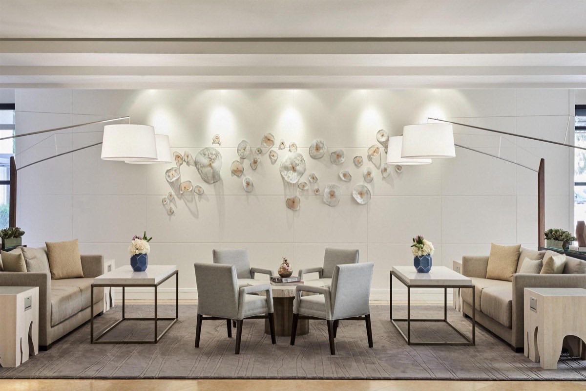 Lobby lounge seating with sculptural wall art